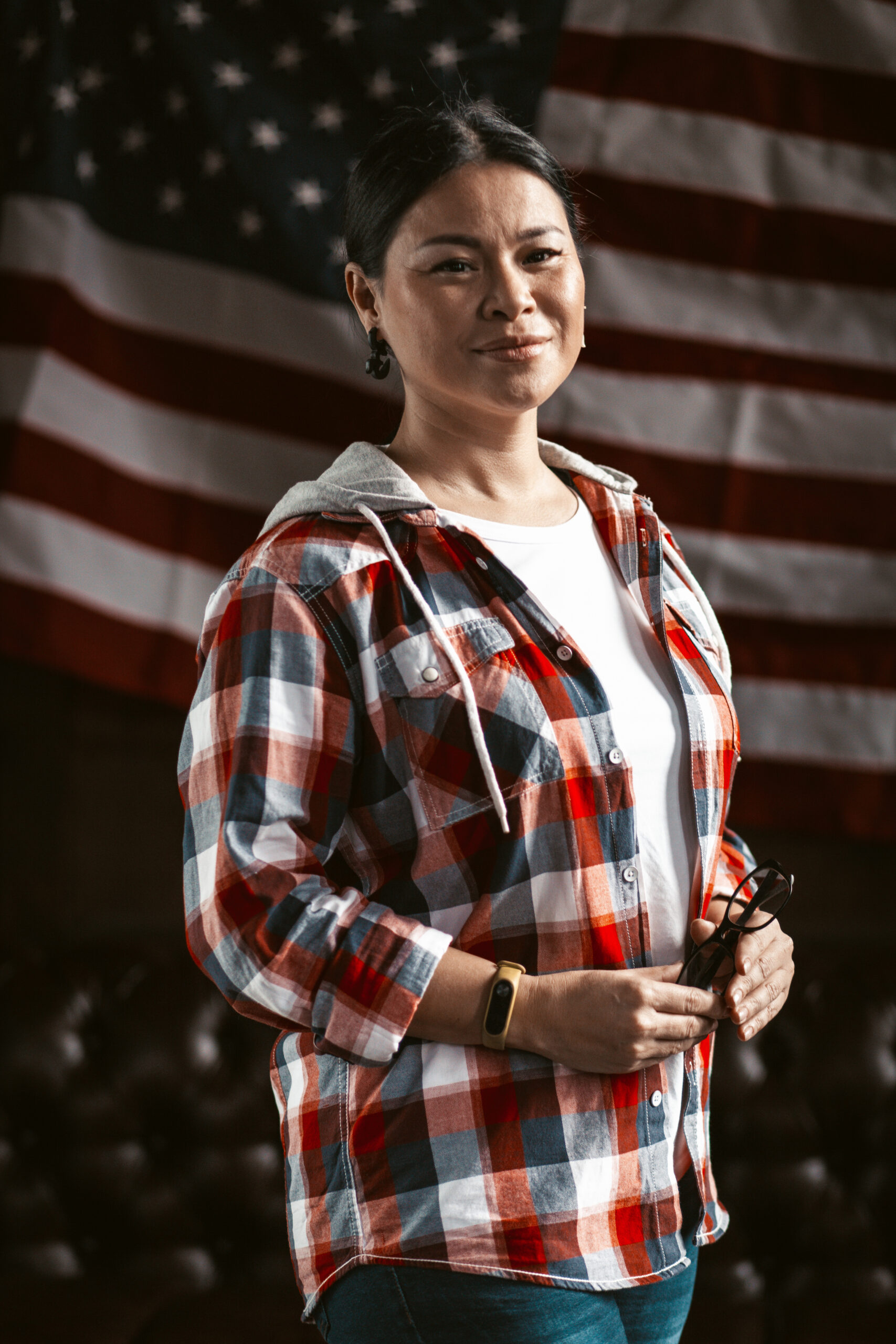 Immigrant in front of American flag